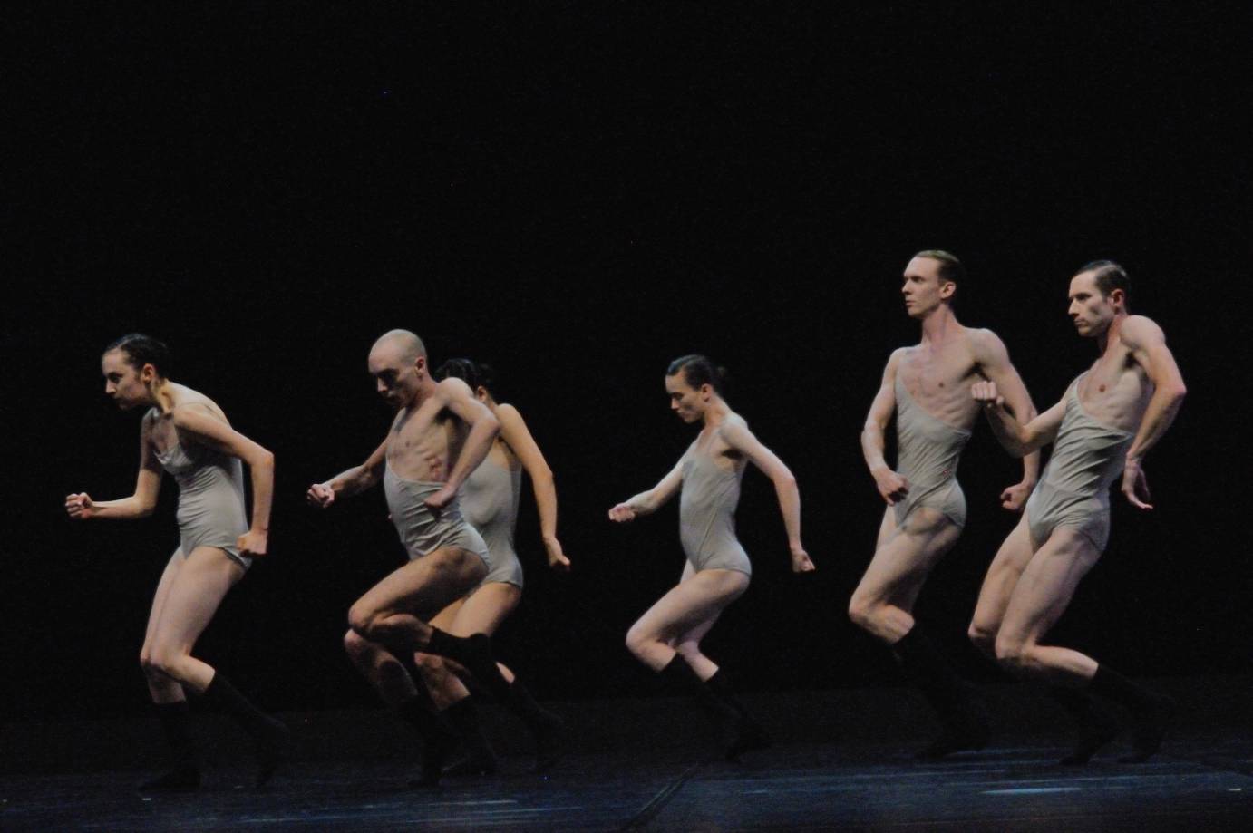 Six dancers jump in profile